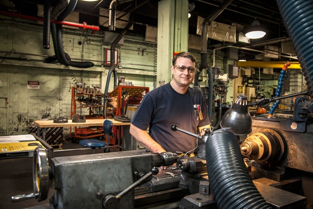 Machinist Apprentice Michael Lovelady operates a lathe in Building 9201-1 graphite shop.