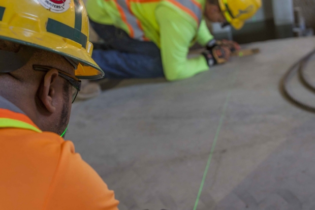 A Uranium Processing Facility (UPF) crew performs layout work in the UPF Salvage and Accountability Building.