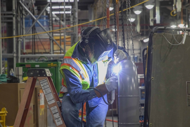 UPF Welder and Pipe Fitter works on a Mechanical Electrical Building pipe.