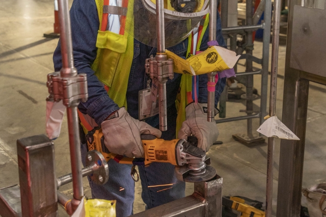 Pipefitter working in the Main Process Building