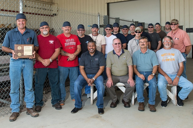 The 50‑year sprinkler head replacement crew works so close to ceilings that they must wear these special “bump caps” instead of hard hats. The crew received a DOE/NNSA Excellence this fall for their effort