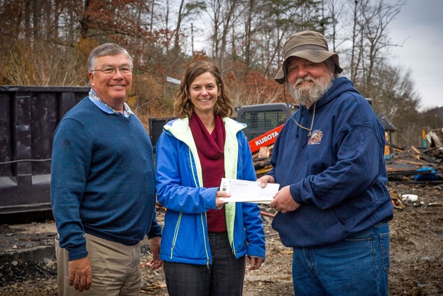 Gene Patterson (left) and Alison Sides present a donation on behalf of the Y‐12 Employee Advisory Committee to the Little Ponderosa Zoo’s owner James Cox.