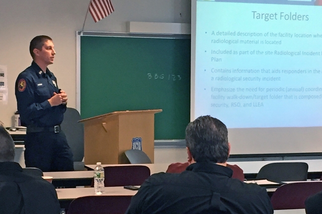 Kevin Probst of the Nassau County Police Department speaks with colleagues at a customized Alarm Response Training course.