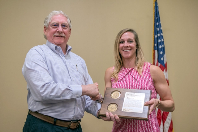 Meghann Parrilla accepts the NNSA Bradley A. Peterson Contractor Security Professional of the Year award from NNSA Deputy Associate Administrator for Defense Nuclear Security David B. McDarby at an awards ceremony at the Y-12 New Hope Center. Meghann Parrilla accepts the NNSA Bradley A. Peterson Contractor Security Professional of the Year award from NNSA Deputy Associate Administrator for Defense Nuclear Security David B. McDarby at an awards ceremony at the Y-12 New Hope Center.