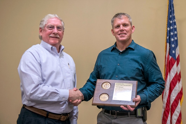 Neal Wolfenbarger, right, accepts the NNSA Security Manager of the Year award from NNSA Deputy Associate Administrator for Defense Nuclear Security David B. McDarby at an awards ceremony at the Y-12 New Hope Center.