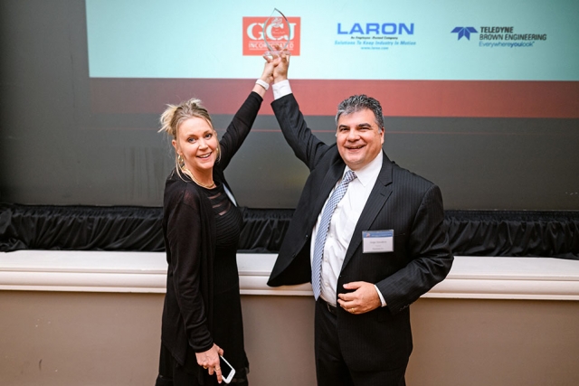 Deana and Jorge Sanabria, owners of ExpoQuip, Inc., holding their award from Bechtel National, Inc. as a small business supplier. 