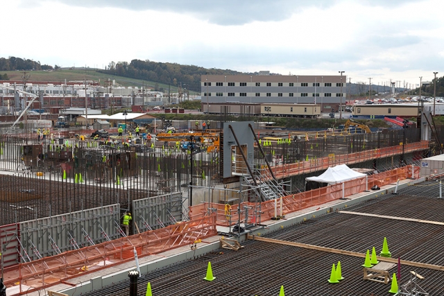 Rebar is being placed for the walls of the Main Process Building. The square frame is for an emergency egress door and weighs 22,000 lbs. 