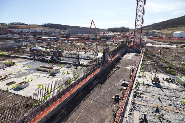 This view of part of the UPF construction site shows the Main Process Building on the left and the Salvage and Accountability Building on the right. 