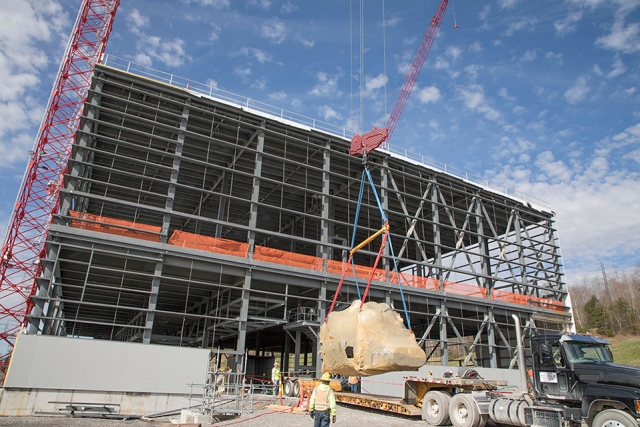 A large chiller unit is lifted onto a platform to be placed inside the Mechanical Electrical Building at the Uranium Processing Facility March 15. The chiller is one of four units delivered to the MEB in March, and is the first major piece of equipment to arrive at the building.