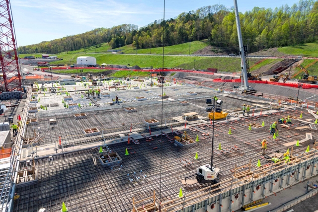 Concrete crews finish the base slab for the Salvage and Accountability Building. Placement of the topping slabs is underway.