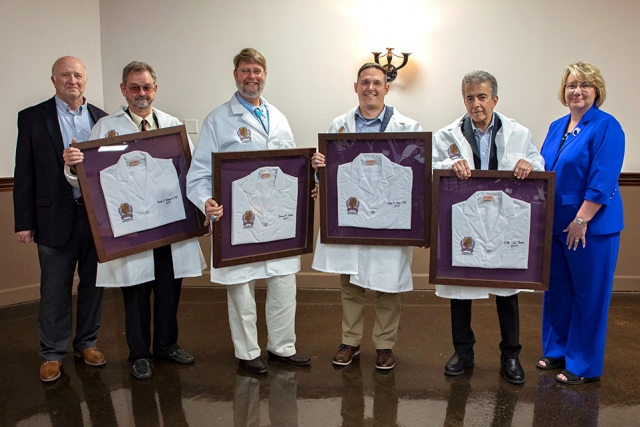 Consolidated Nuclear Security’s Dave Beck, vice president of Program Integration, and Michelle Reichert, chief operating officer, congratulate Y-12 League of Ingenuity inductees, second from left, Rusty Hallman, Ed Ripley, Ashley Stowe, and Lee Bzorgi.