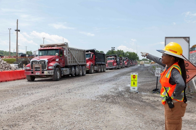 Fill material supporting utility work is delivered to the Uranium Processing Facility construction site.