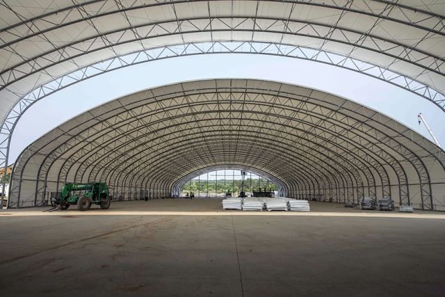 Fabric is added onto the steel frame to construct the 100,000 square foot facility that will serve as the primary fabrication area during the construction of UPF.