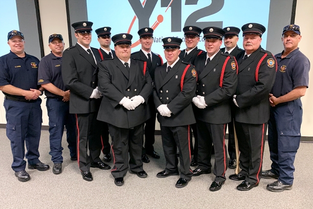 Pantex Honor Guard members Jeremy Baker (left), Chris Lewis (second from left), and Bobby Nash (far right) train the newly formed Y-12 Fire Department Honor Guard whose members include (starting third from left): Ben Norton, Doug Allen, Joe Herrell, Brandon Hitchcock, Lee Scofield, Jonathan Rood, Craig Shaver, Josh Bray and Bob Strunk.