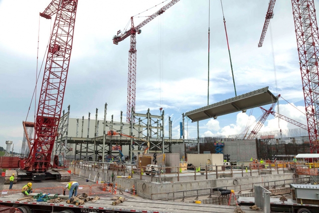 A crane moves a steel beam to be installed at the Uranium Processing Facility Project’s Salvage and Accountability Building. The first phase of structural steel installation will continue over the summer and calls for almost 800 pieces that collectively weigh about 1,500 tons. 