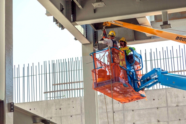 Ironworkers install structural steel pieces in the first level of the Uranium Processing Facility Salvage and Accountability Building.