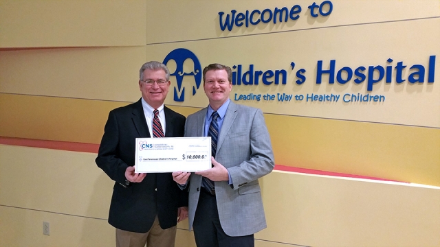 Y-12’s Site Manager Bill Tindal (right) presents a 0,000 donation to East Tennessee Children’s Hospital CEO Keith Goodwin in support of the hospital’s capital campaign.  