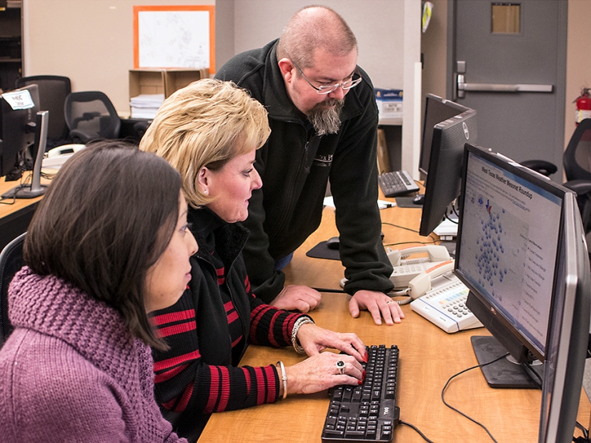 Pantex Emergency Services members (from left) Maribel Martinez, Brenda Graham and Greg Roddahl learn how to use the Emergency Management Information System, or EMInS.